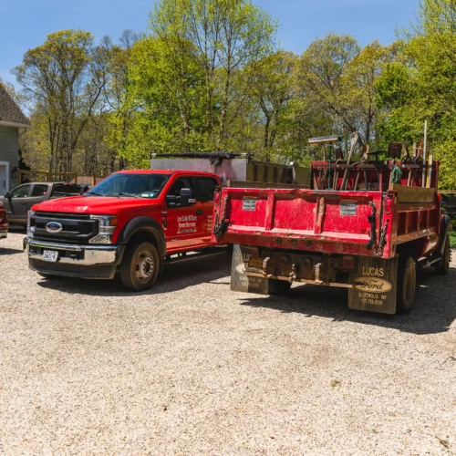 Jon Lake & Sons work trucks in Long Island showcasing landscaping and property maintenance services