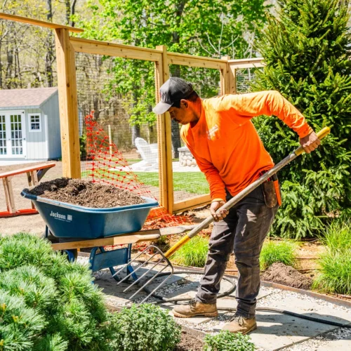 Jon Lake & Sons professional landscaping crew installing garden features
